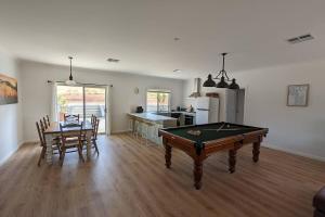 a living room with a pool table and a kitchen at Clare Valley Escape in Leasingham