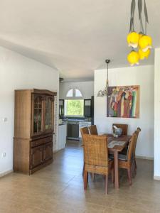 a kitchen and dining room with a table and chairs at Villa With Swimming Pool in Ulcinj