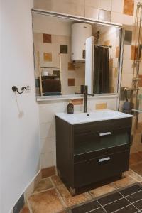 a bathroom with a sink and a mirror at La Bellamar - Apartamento en primera línea mar- in Premiá de Mar +24 photos