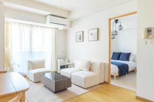 Ένα ή περισσότερα κρεβάτια σε δωμάτιο στο Cozy Stay Sapporo New Central