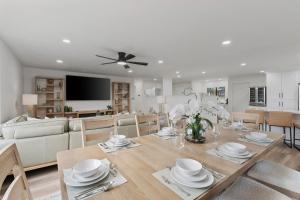 a dining room and living room with a table and chairs at All-New Luxe Stay Views, Sauna & Hot Tub villa in Holladay