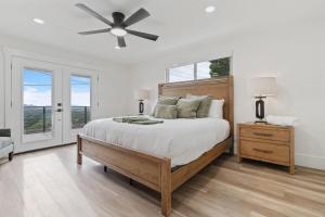 a bedroom with a bed and a ceiling fan at All-New Luxe Stay Views, Sauna & Hot Tub villa in Holladay +90 photos