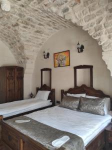 Ένα ή περισσότερα κρεβάτια σε δωμάτιο στο Babilyon Otel