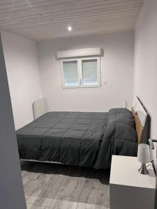 Postel nebo postele na pokoji v ubytování Appartement climatisé