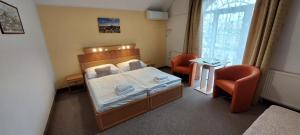 Cama ou camas em um quarto em Hotel Zámeček