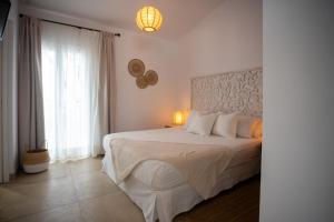 A bed or beds in a room at Moorea Boutique - Only Adults