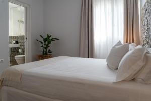 A bed or beds in a room at Moorea Boutique - Only Adults
