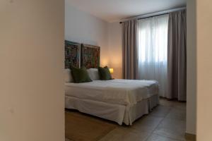 A bed or beds in a room at Moorea Boutique - Only Adults