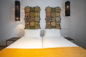 A bed or beds in a room at Moorea Boutique - Only Adults