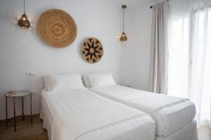 A bed or beds in a room at Moorea Boutique - Only Adults