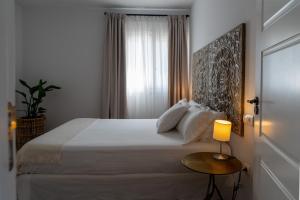 A bed or beds in a room at Moorea Boutique - Only Adults