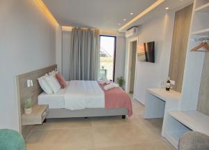 a bedroom with a bed and a large window at Melina Apartments Sea & City in Chania Town