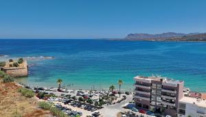 an aerial view of a parking lot next to the ocean at Melina Apartments Sea & City in Chania Town