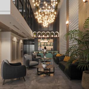 a lobby with couches and chairs and a table at Nature Hotel - Lac Long Quan in Hanoi