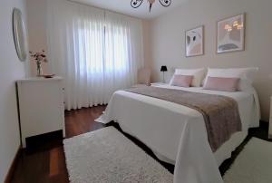 Posteľ alebo postele v izbe v ubytovaní Rías Baixas en Ribeira piso céntrico con parking y wifi