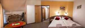 Cama ou camas em um quarto em Hotel Zámeček