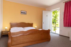 Cama ou camas em um quarto em Hotel Zámeček
