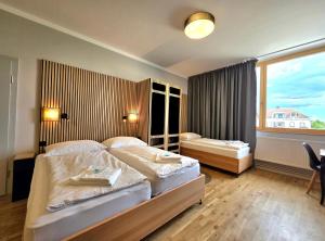 Postel nebo postele na pokoji v ubytování Guesthouse Purbach