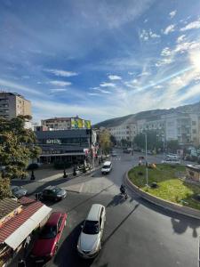 a city street with cars parked on the road at Miya Apartment in Veles +6 photos