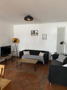 a living room with a couch and a coffee table at Ferienweingut Schlägel in Bremm