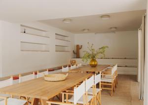 a dining room with a wooden table and chairs at wecamp Cabo de Gata in Las Negras +67 photos