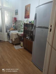 a kitchen with a refrigerator and a sink at Guest House Armen in Yerevan +20 photos