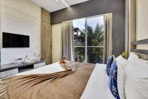 Ένα ή περισσότερα κρεβάτια σε δωμάτιο στο The Ratna villa +21 φωτογραφίες