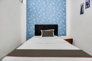 Postel nebo postele na pokoji v ubytování Hotel O Sawariya Regency