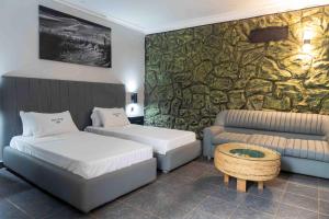 Letto o letti in una camera di Mirembe Hotels - Source of the Nile Suites