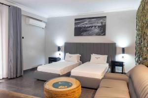 Letto o letti in una camera di Mirembe Hotels - Source of the Nile Suites