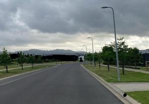 an empty street with a white van driving down the road at J&R Home, A Gippsland Getaway in Jeeralang Junction