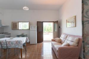 a living room with a couch and a table at Casa Domitia in Latiano
