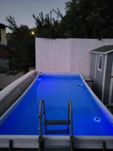 a large blue swimming pool on top of a building at Villa Rita in Cueva Grande