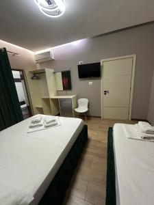 Postel nebo postele na pokoji v ubytování Guesthouse Dauti