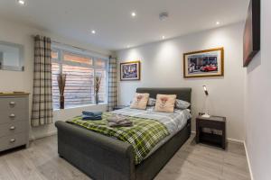 Ένα ή περισσότερα κρεβάτια σε δωμάτιο στο Highland Retreats Cannich