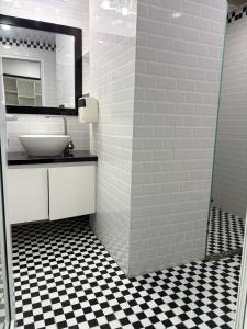 a bathroom with a sink and a mirror at Muong Thanh Oceanfront Retreat apartment in Nha Trang