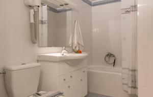 a bathroom with a toilet and a sink and a shower at Pavlos Hotel in Kos Town