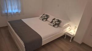 Postel nebo postele na pokoji v ubytování Apartments Rotim