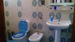 a bathroom with a toilet and a sink at Casa Vacanze Corso Umberto in Giardini Naxos +23 photos