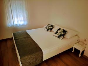 Postel nebo postele na pokoji v ubytování Apartments Rotim