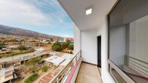 a balcony with a view of a city at A 10 minutos del centro de Cochabamaba in Cochabamba