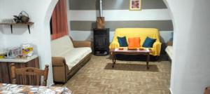 a living room with a couch and a table at Kuća na selu in Šavnik