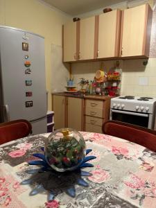 a kitchen with a table with a bowl on it at Apartman Ex-Yu in Španjola