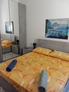 a bedroom with a bed with two towels on it at Flat in Olbia Centro in Olbia
