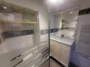 a white bathroom with a sink and a shower at Studio cosy 4 pers. front de neige avec WiFi à Montgenèvre - FR-1-266-85 in Montgenèvre