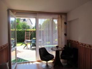 a room with a sliding glass door leading to a patio at Willa Pasat in Władysławowo