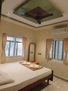 Ένα ή περισσότερα κρεβάτια σε δωμάτιο στο Rocky Guesthouse
