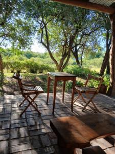 a table and two chairs on a patio at Varuna- en La Casa de Nanda in San Javier