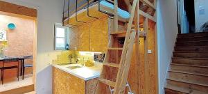 a kitchen with a sink and a wooden ladder at Aveiro Train Studios in Aveiro +107 photos