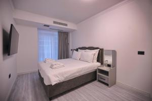 Ένα ή περισσότερα κρεβάτια σε δωμάτιο στο Diamond Titanic Resort +113 φωτογραφίες